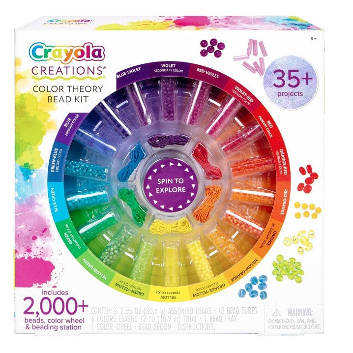 Close-up of a Crayola Creations Color Theory Bead Kit box with a color wheel-shaped bead organizer. The organizer is filled with beads in various colors.